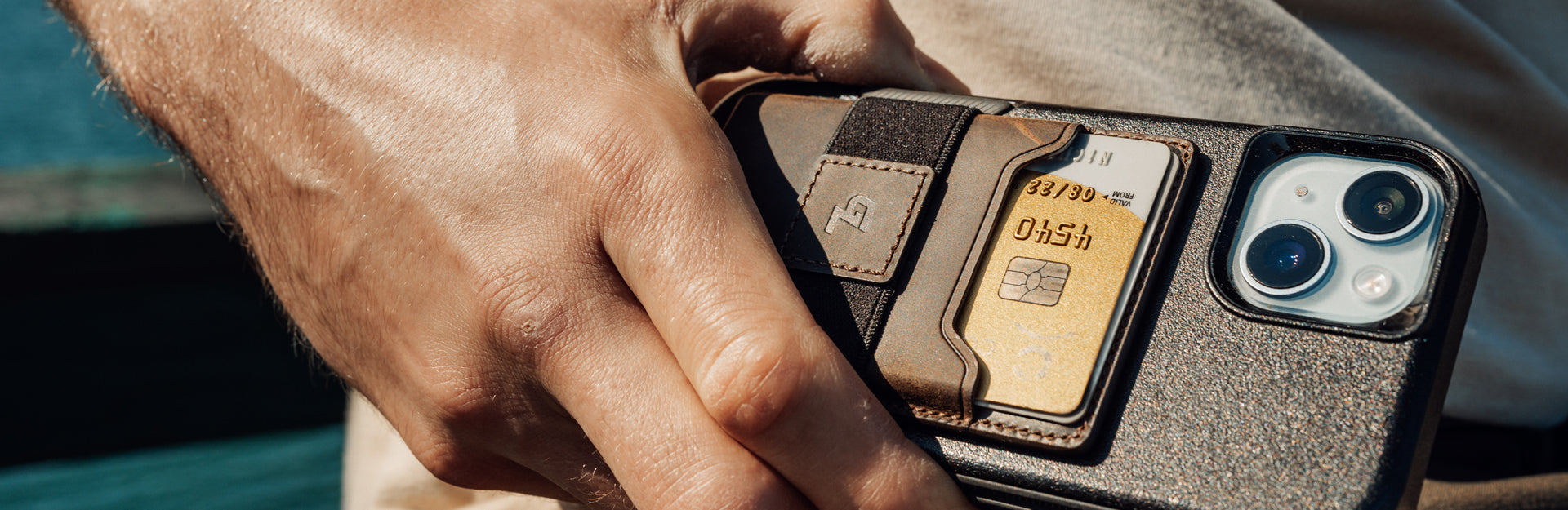 man holding leather wallet