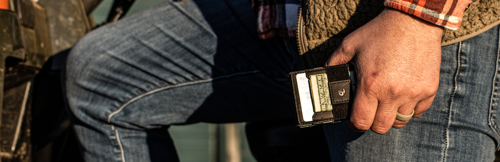 man holding groove wallet