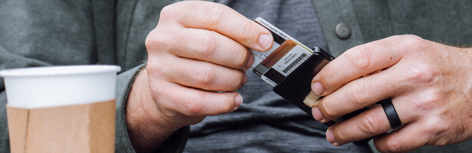 man holding groove wallet