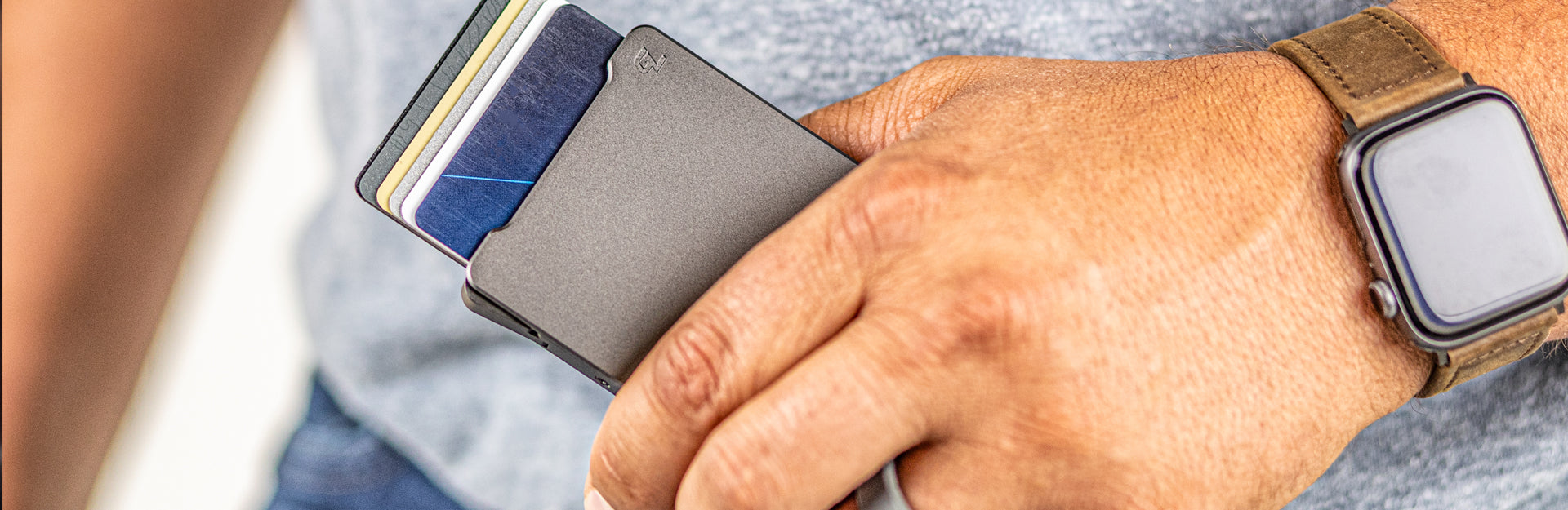 man holding groove wallet