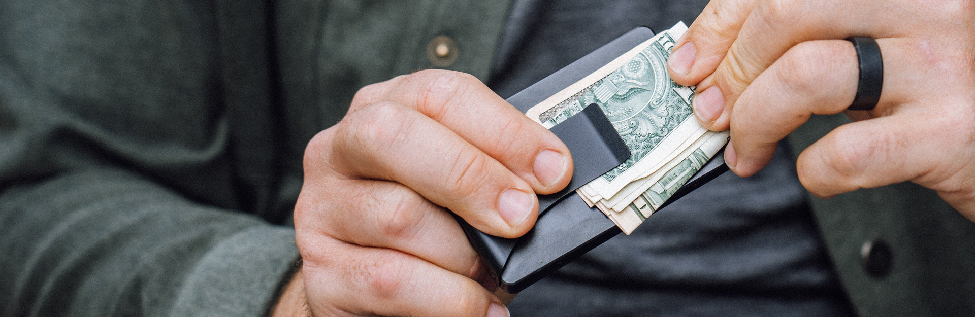 man holding groove wallet with money clip