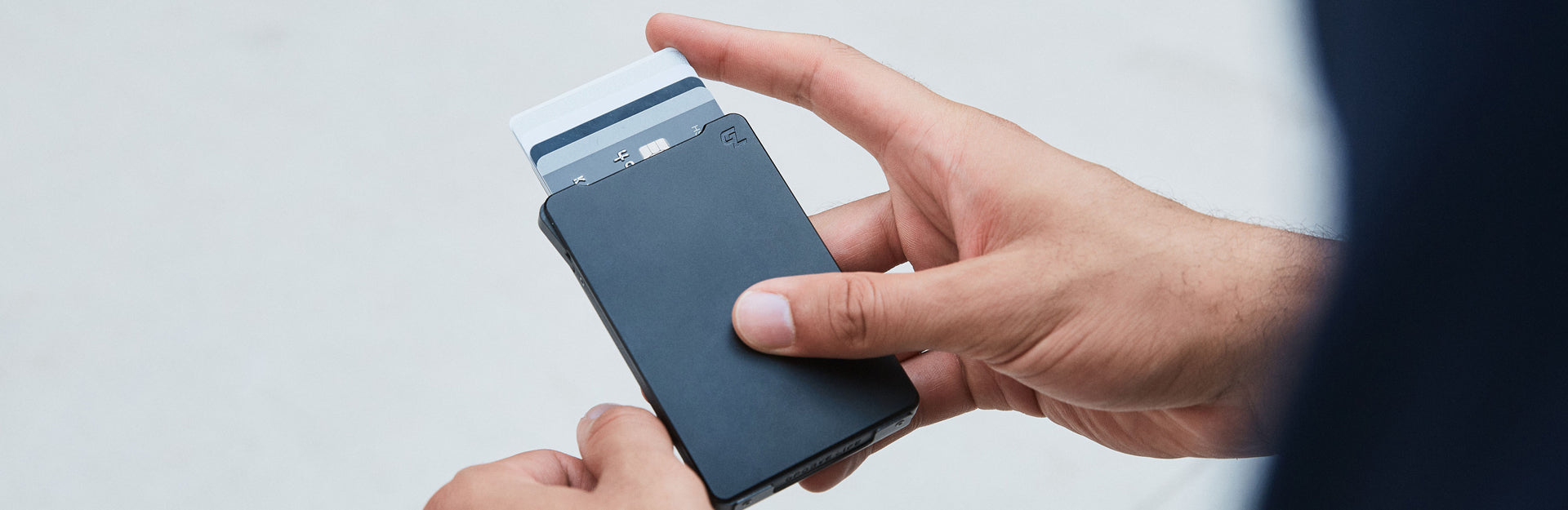 man hodling groove wallet