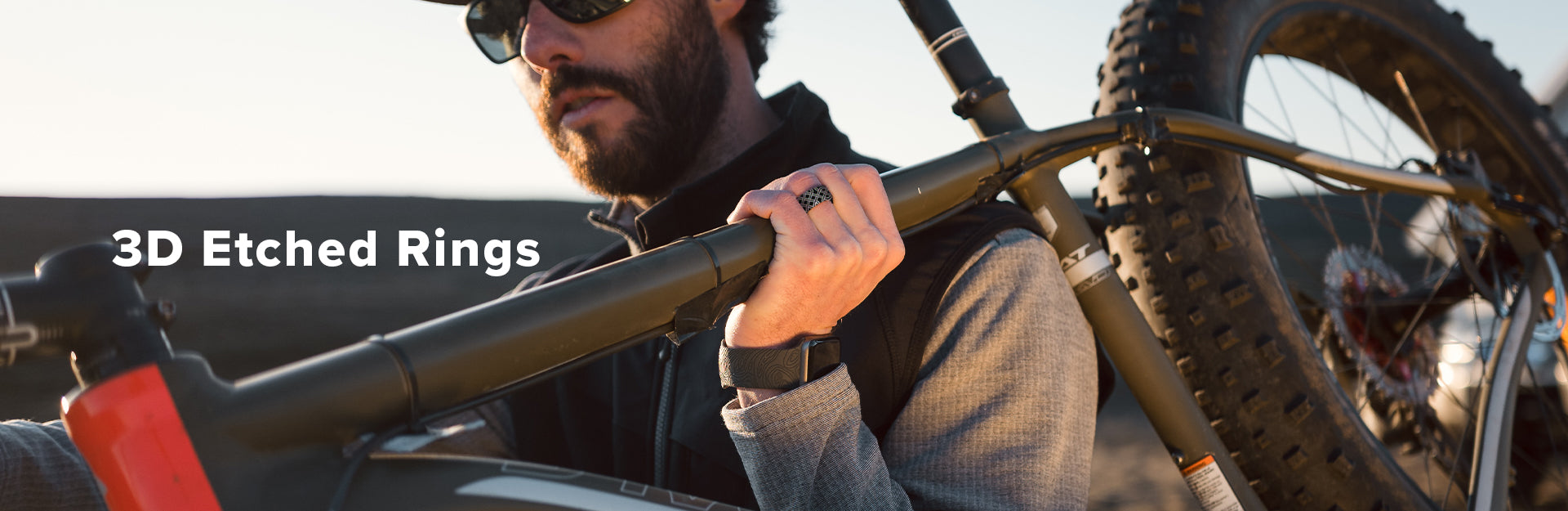 Dimension, three dimension rings are overlaid on a background of mountains at dusk