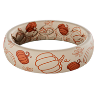 White silicone ring with orange pumpkin patterns on a white background