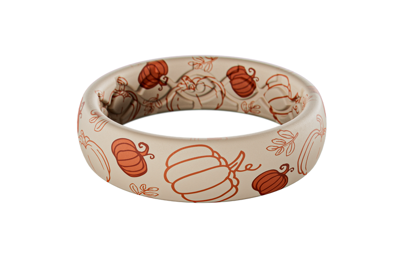 White silicone ring with orange pumpkin patterns on a white background