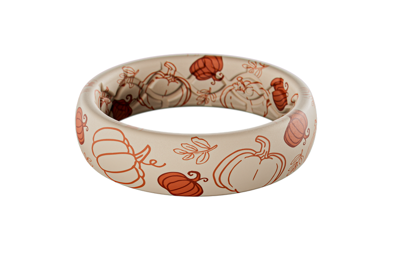 White silicone ring with orange pumpkin patterns on a white background