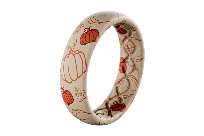 White silicone ring with orange pumpkin patterns on a white background