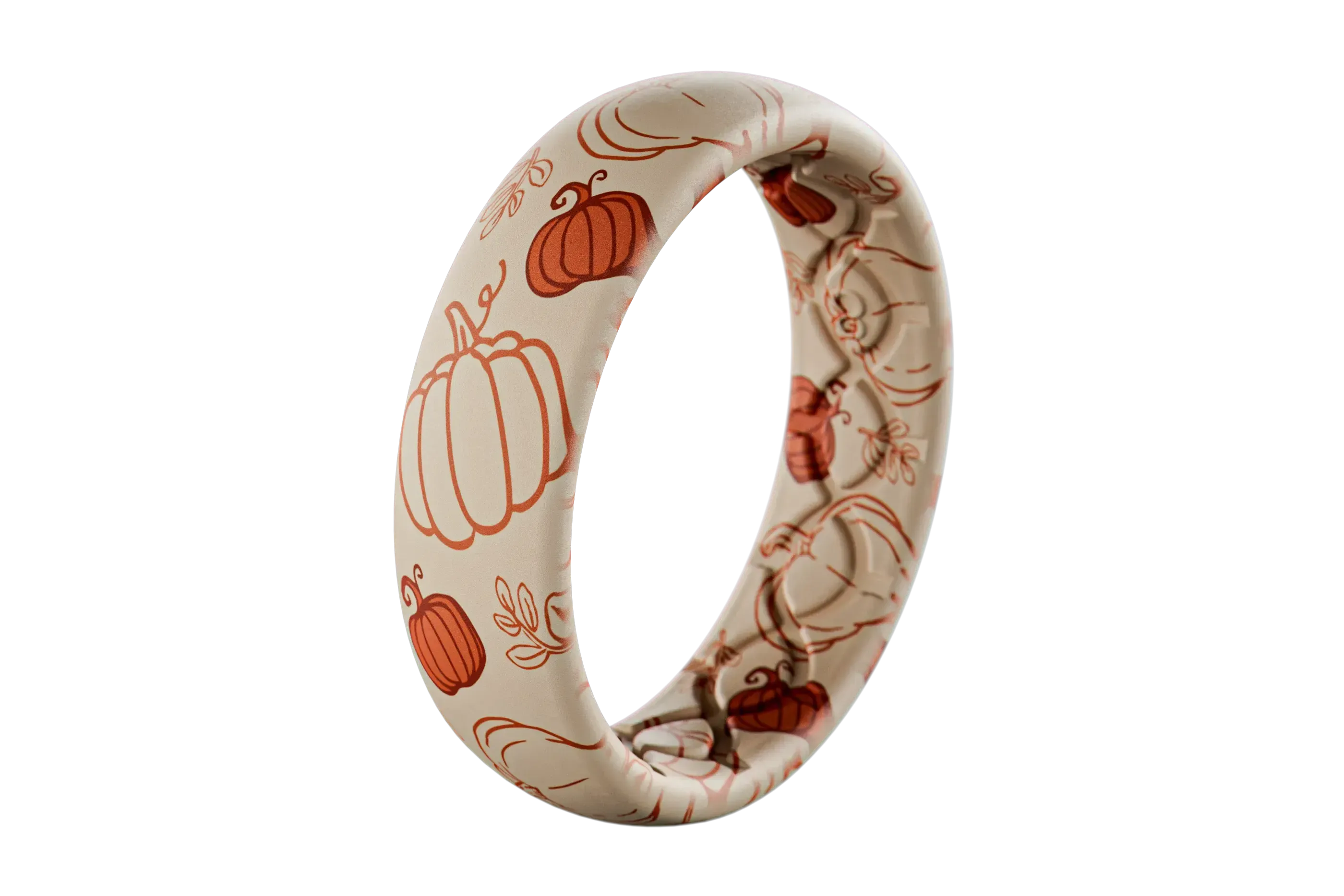 White silicone ring with orange pumpkin patterns on a white background