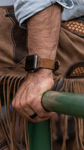 man holding on to railing wearing a Groove Life watch band