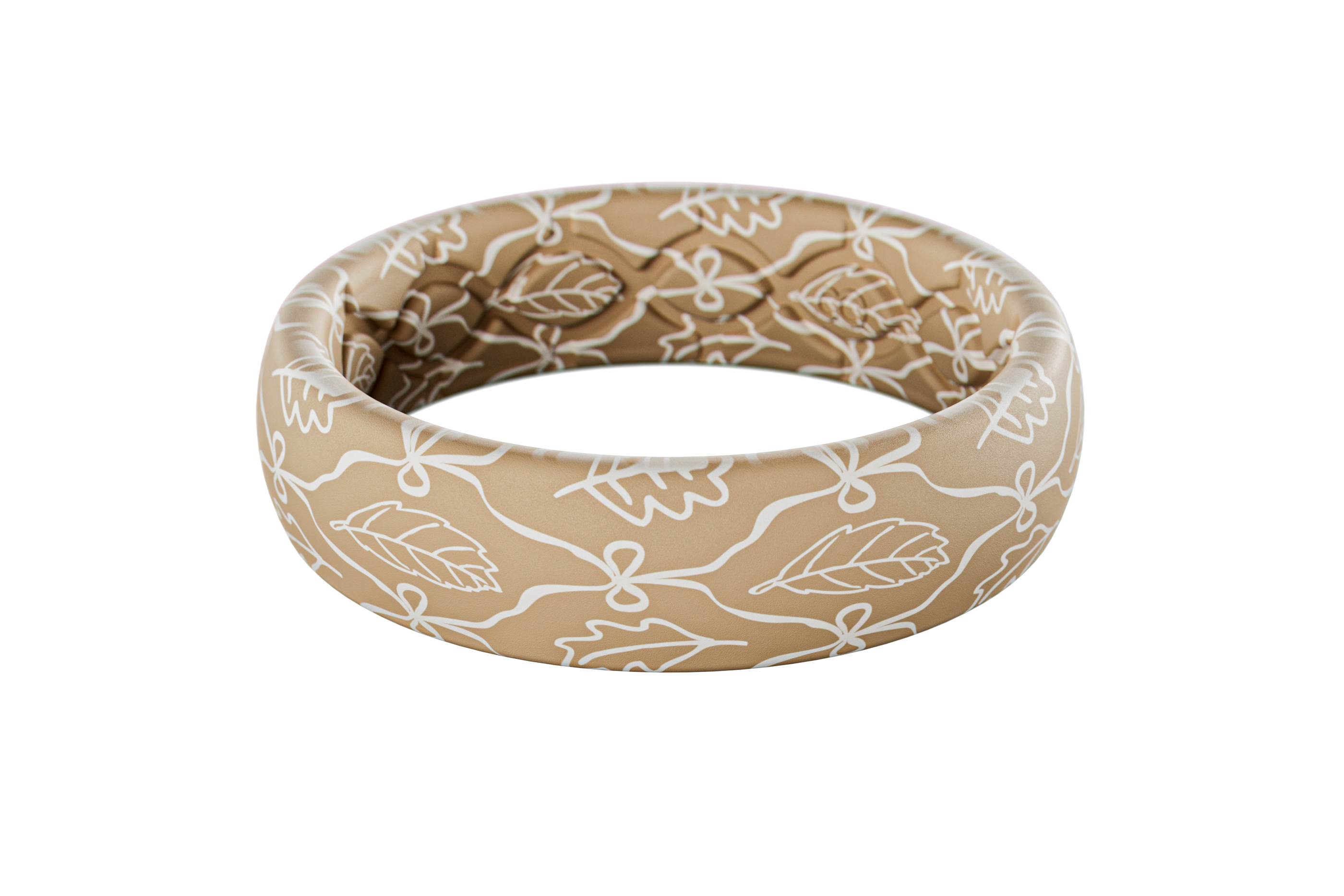Beige silicone ring with white floral pattern on a white background