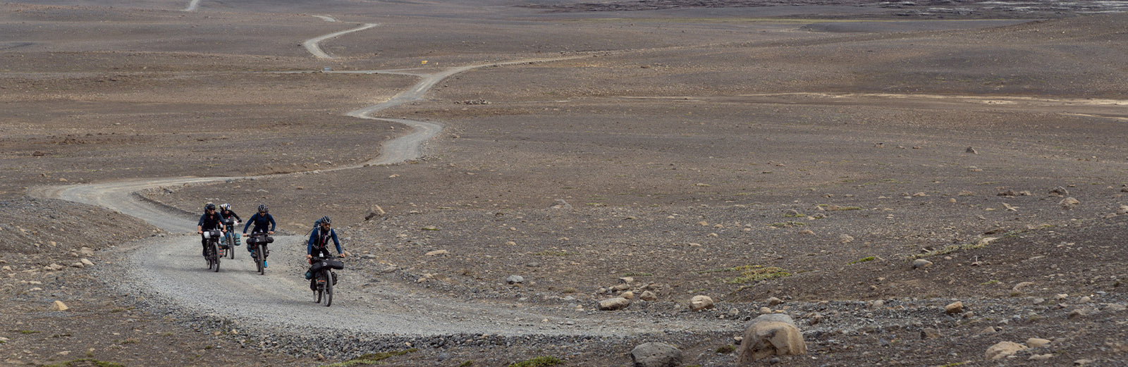 people miking down an old dirt road