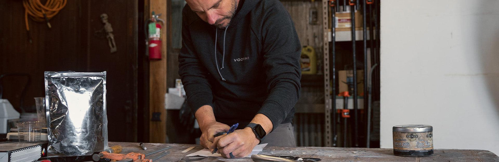 Man writing on a worktable