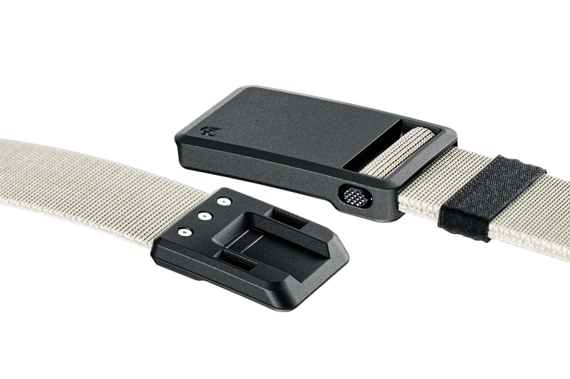 Two black belt buckles with beige straps on a white background