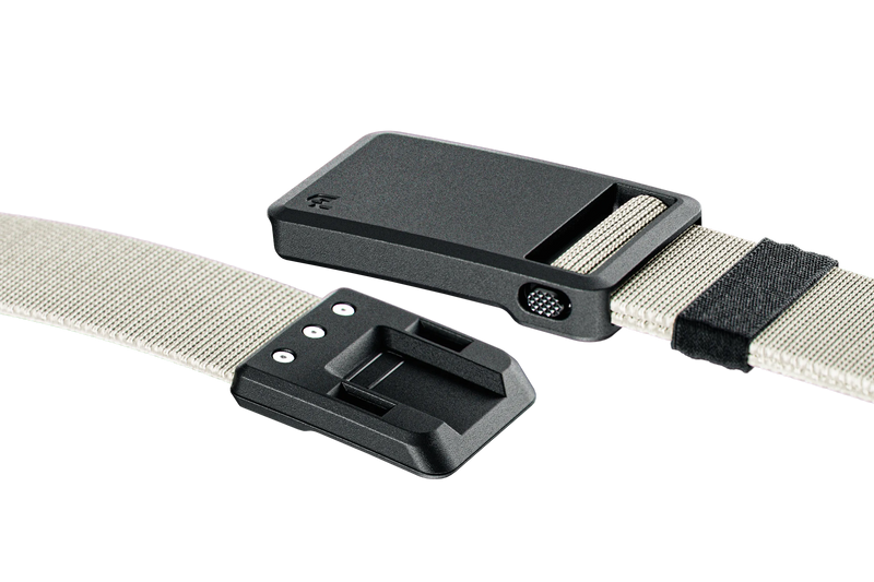 Two black belt buckles with beige straps on a white background