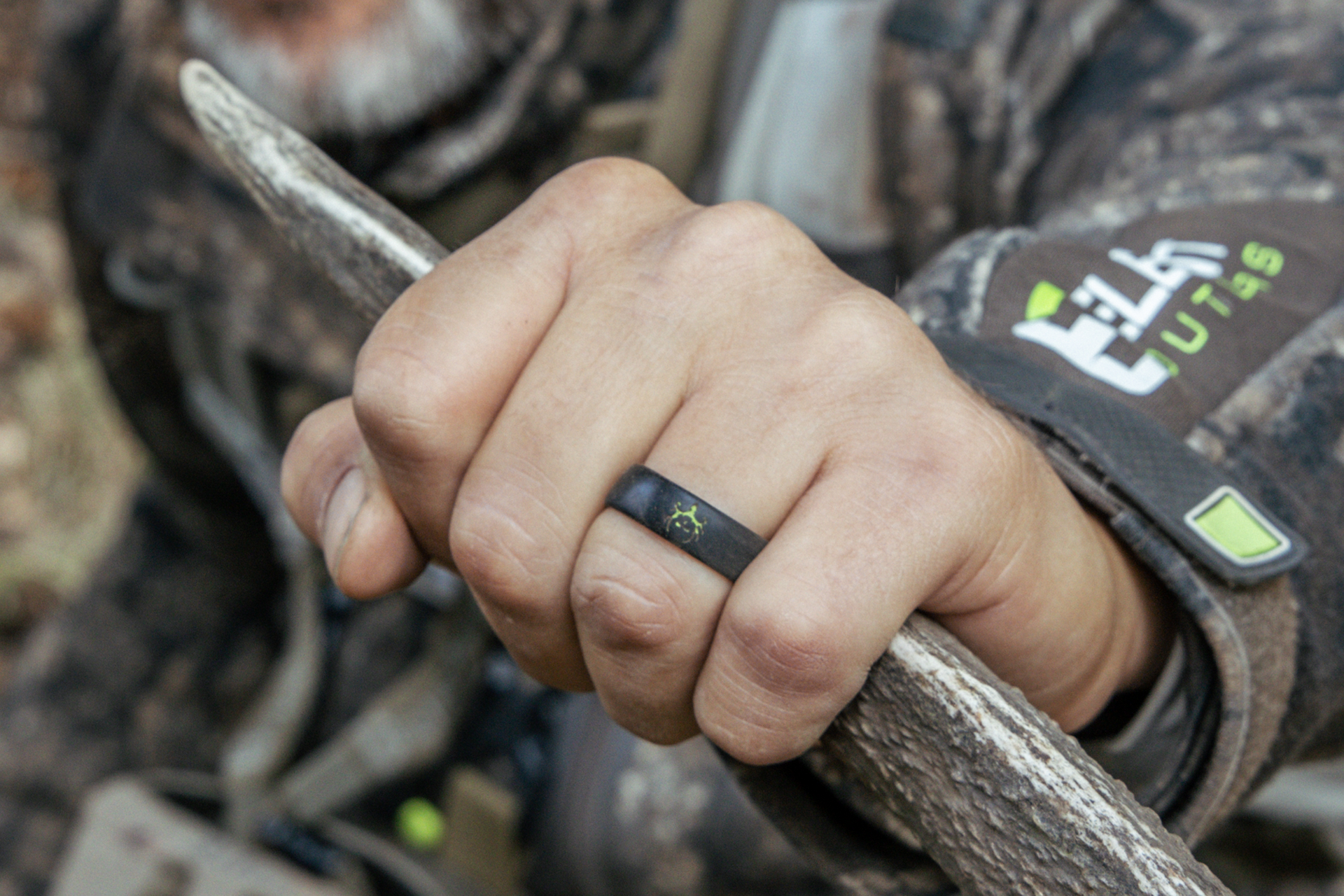 Man wearing bone collector thin midnight ring