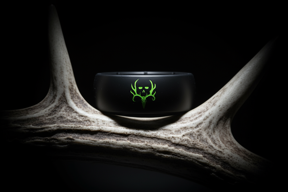 Black ring with green logo on a dark background