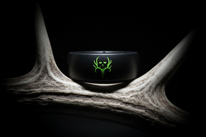 Black ring with green logo on a dark background