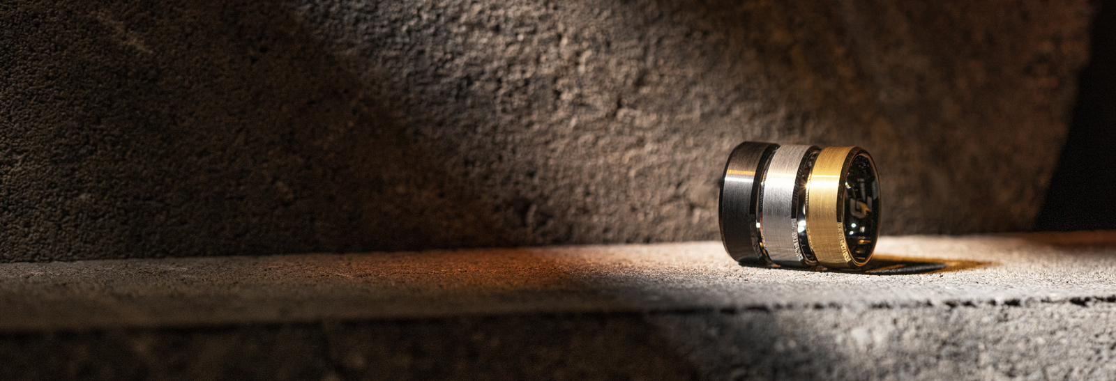 black metal ring, gold metal ring, and platinum metal tungsten ring