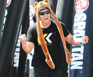 Jerico cheers at a Spartan race while wearing a bear hat