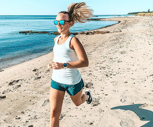 Tiffany Wysocki runs along a long sandy beach